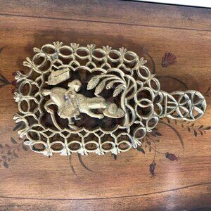 Vintage girl and dog brass trivet